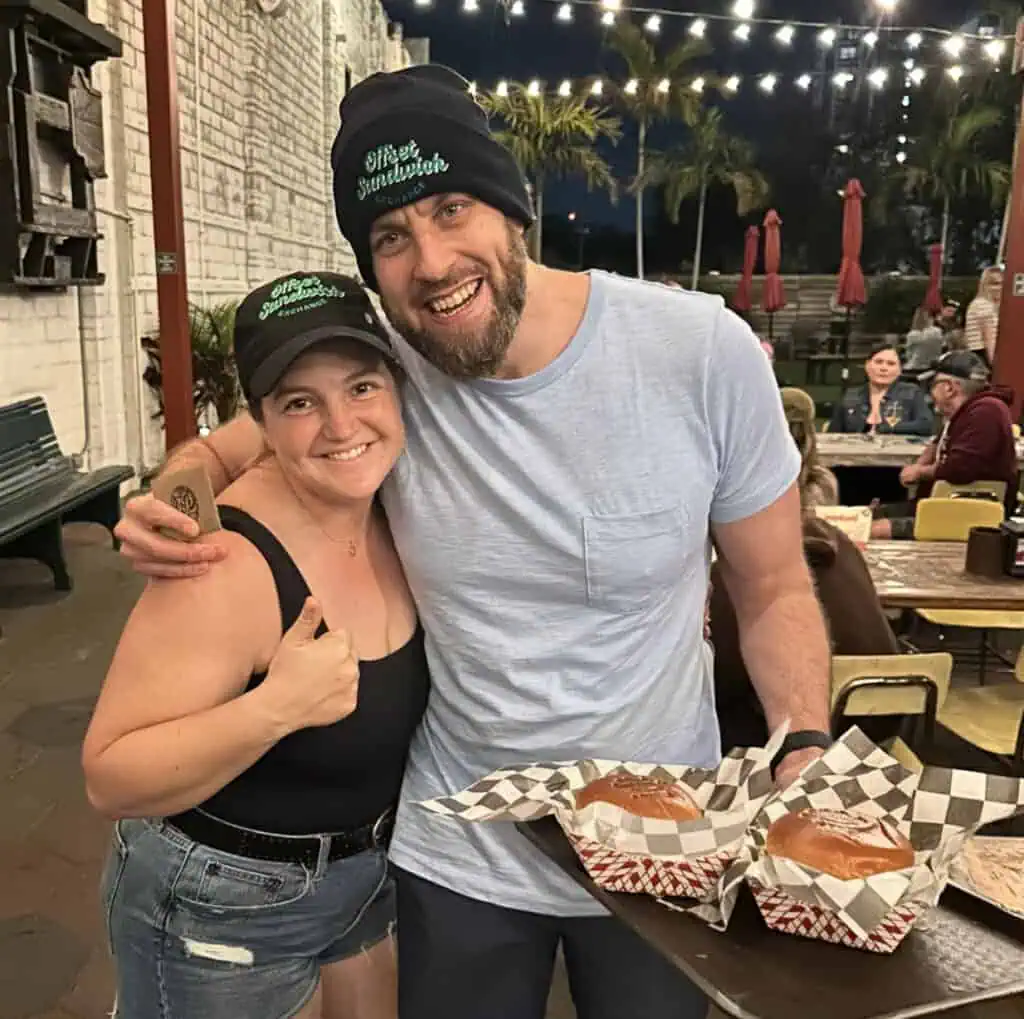 People holding burgers