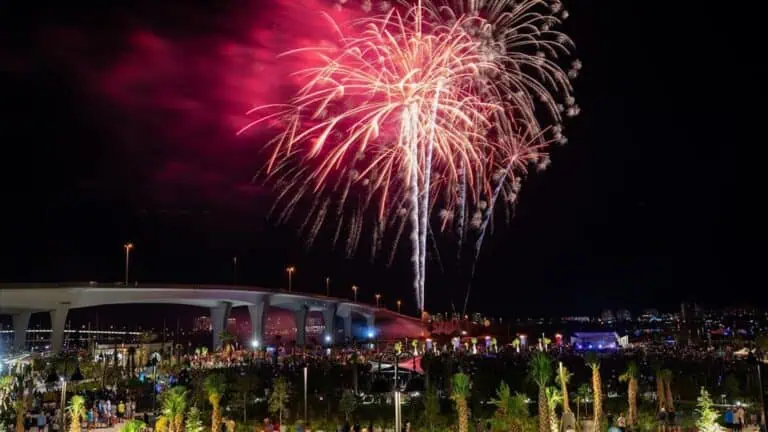 a large waterfront fireworks display on the 4th of July