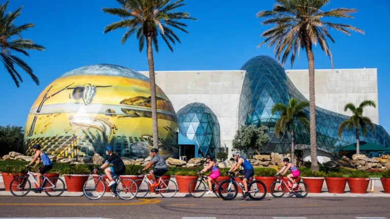 Bikers passing by a museum