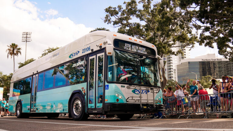 A bus picking up people