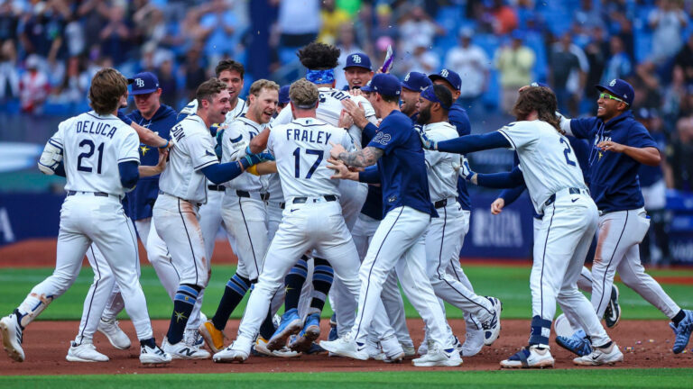 A baseball team celebrating a walk off win