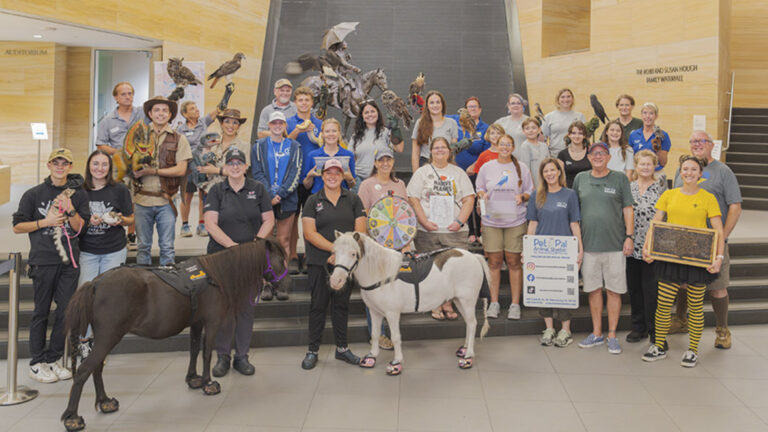 People posing for a photo at the museum