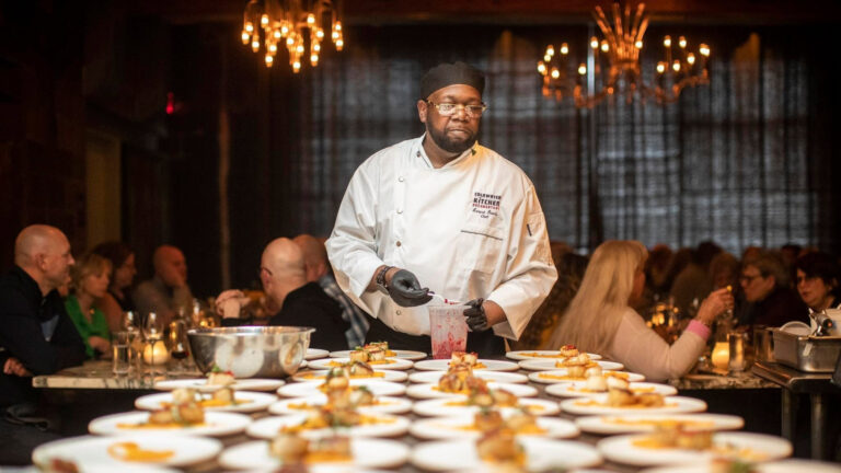 A chef setting up food